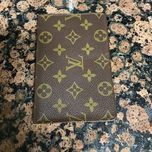 Women’s Louis Vuitton wallet/passport holder.